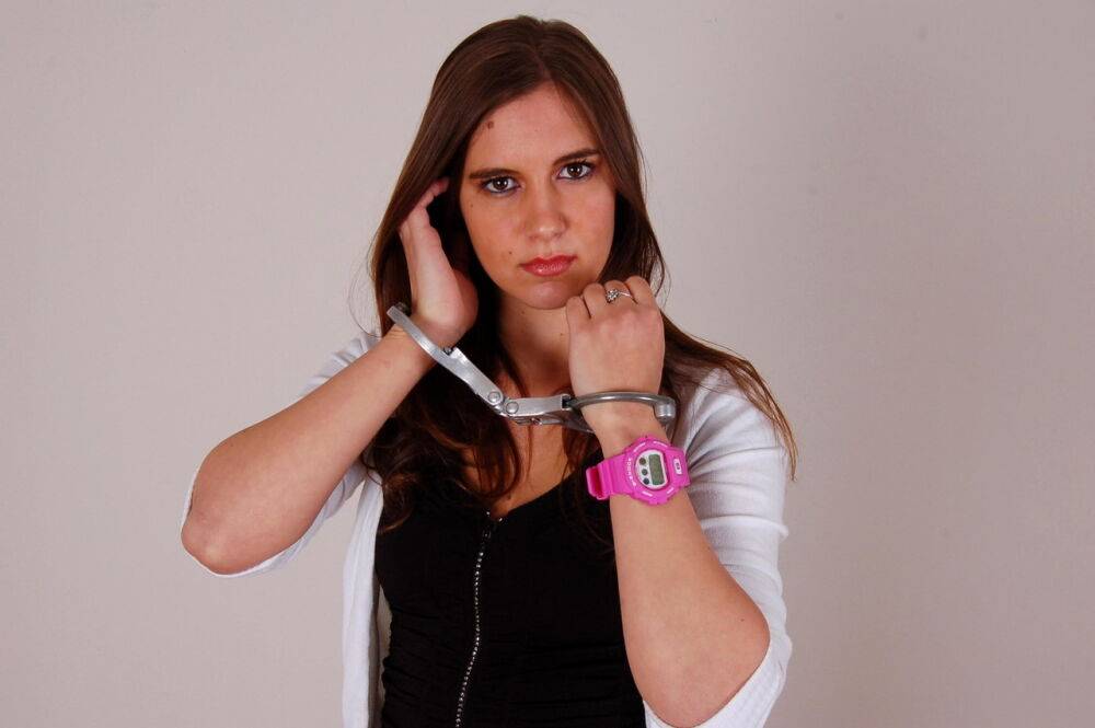 Redheaded amateur Stacey models a G-Shock watch and LIPS handcuffs in jeans - #1