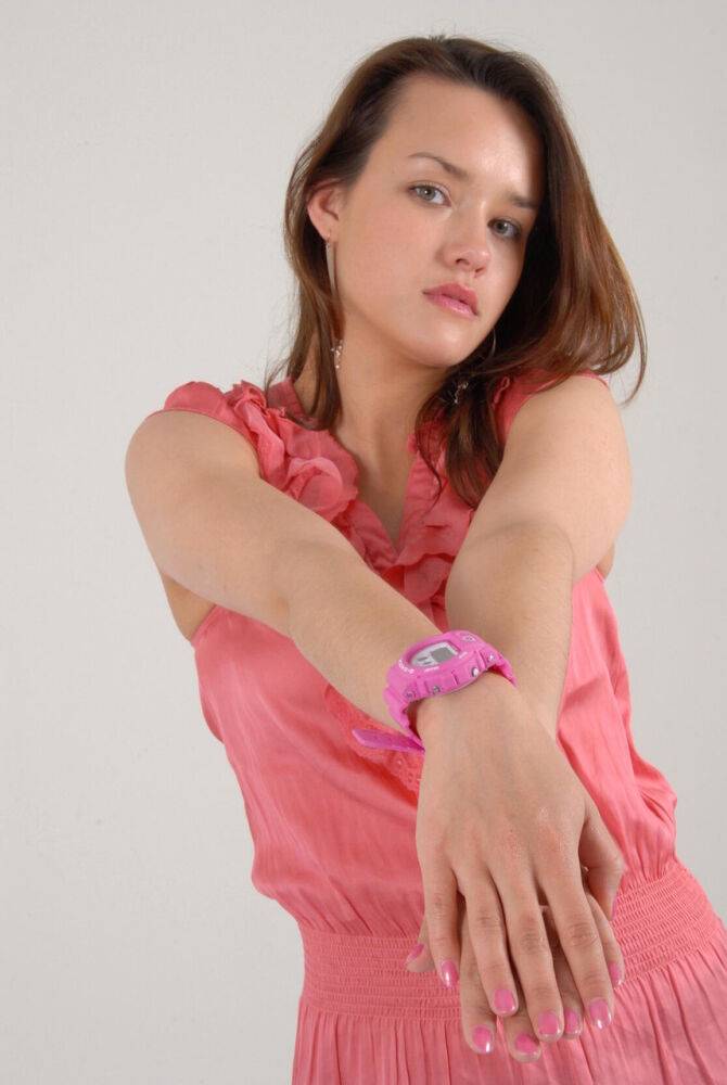 Caucasian female Alice admires her pink G-Shock watch while fully clothed - #3