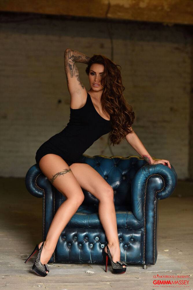 British glamour model Gemma Massey peels off black dress on leather chair - #16