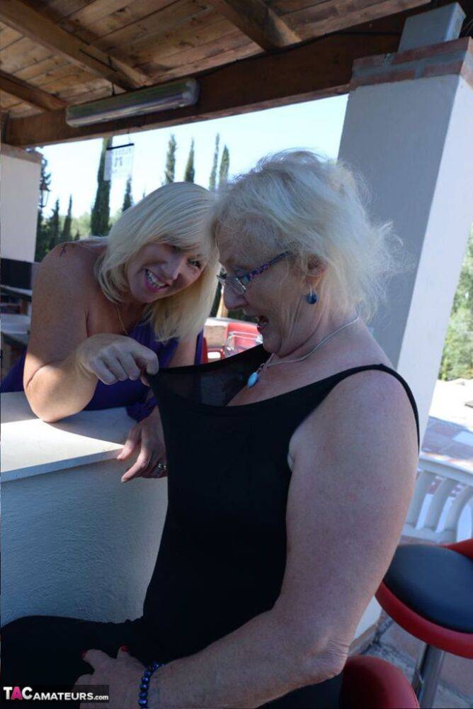 Old women share a lesbian kiss after drinking to much wine out on the patio - #16