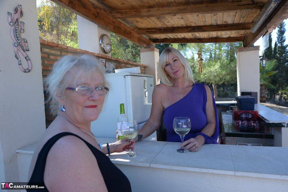 Old women share a lesbian kiss after drinking to much wine out on the patio - #13