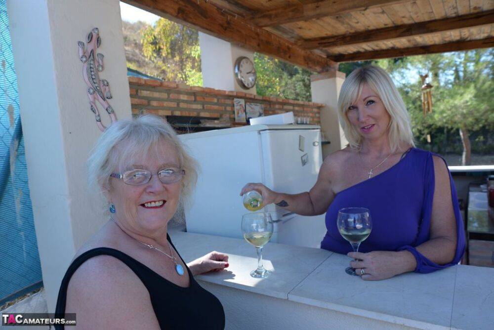 Old women share a lesbian kiss after drinking to much wine out on the patio - #11