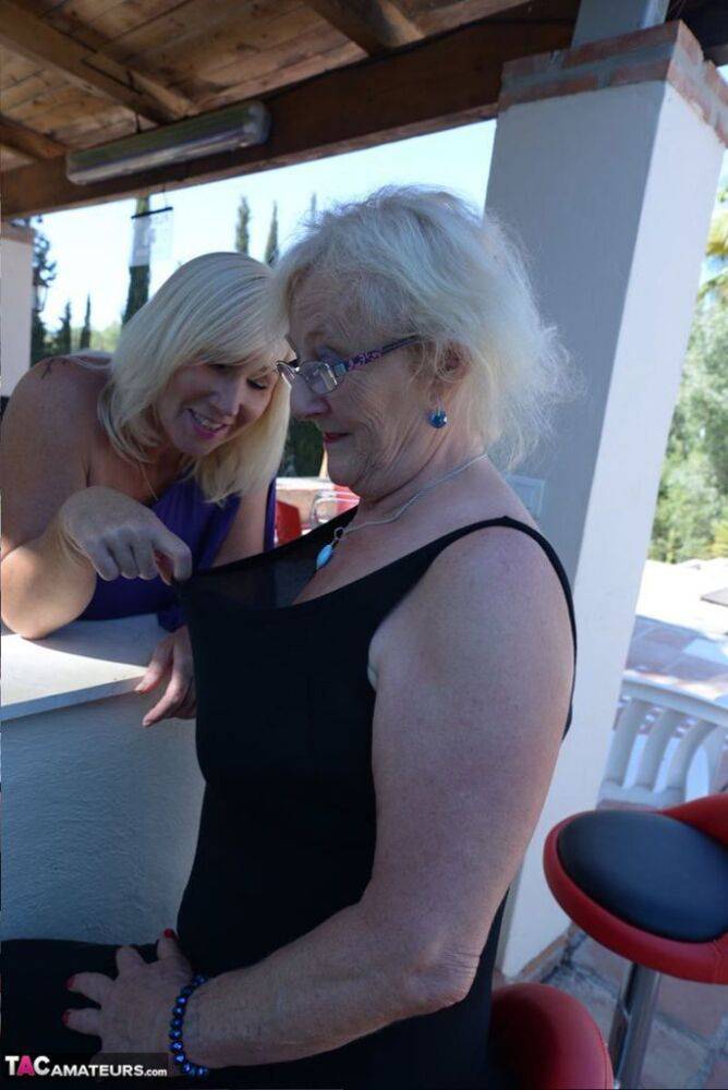 Old women share a lesbian kiss after drinking to much wine out on the patio - #12