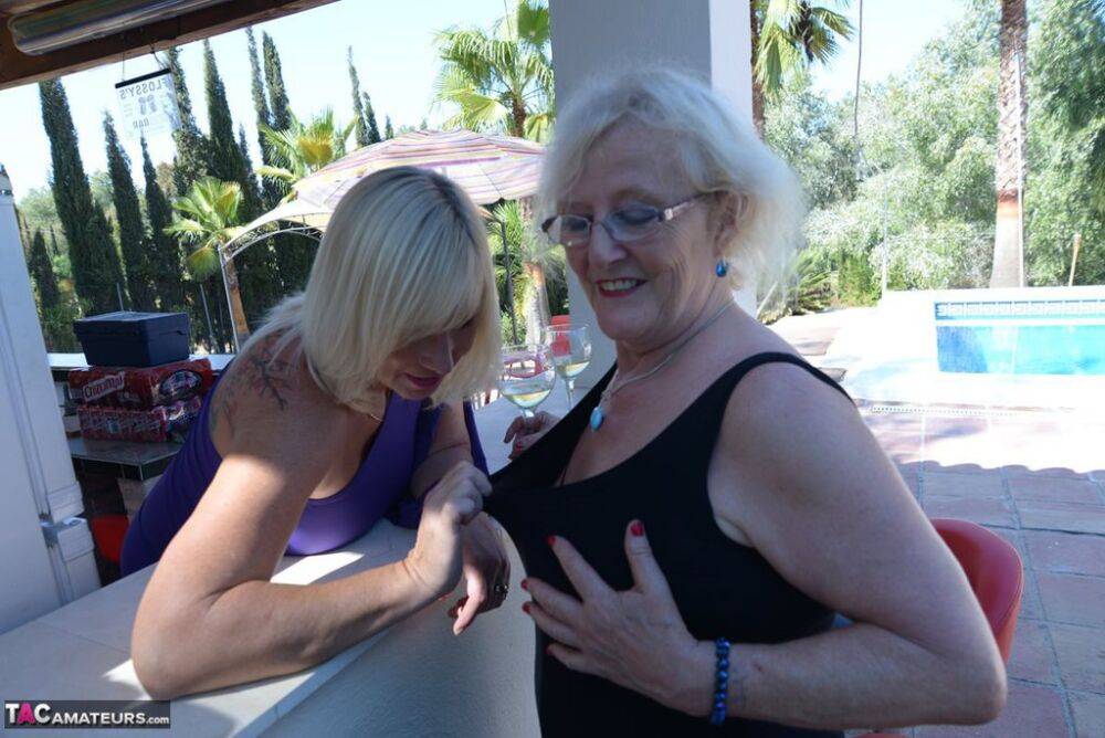 Old women share a lesbian kiss after drinking to much wine out on the patio - #2