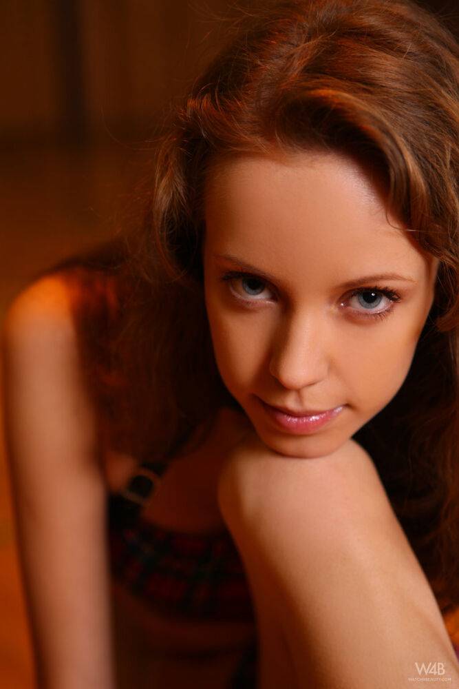 Young redheaded schoolgirl Natasha poses barefoot in plaid attire - #1