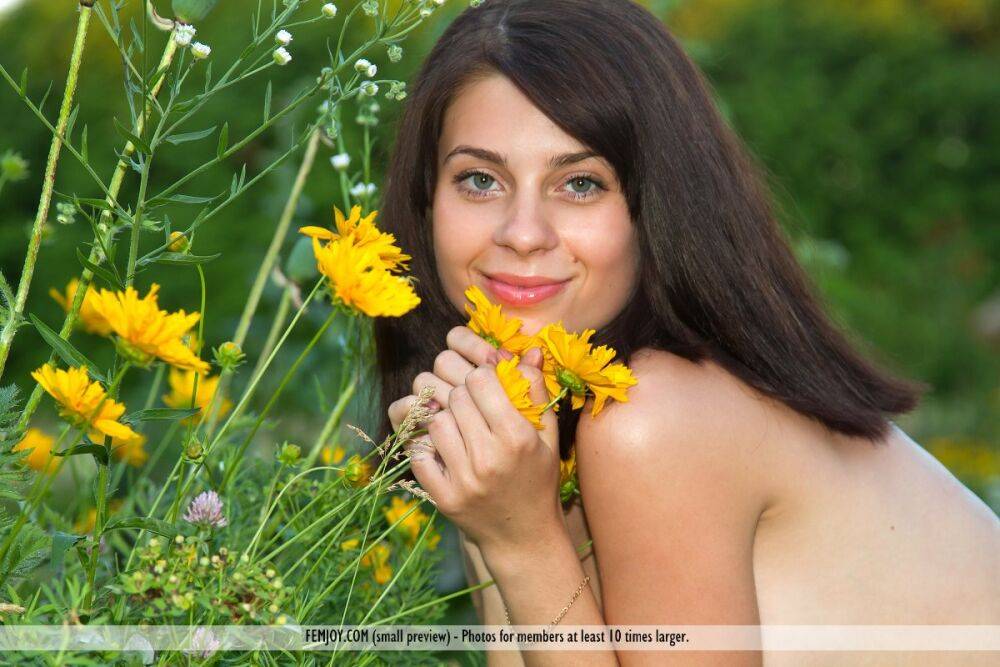 Brunette model Cate S removes a dress before picking wildflowers in the nude - #4