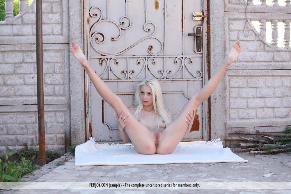 Platinum blonde Vika D doffs white lace underwear to pose nude outside a door - #16