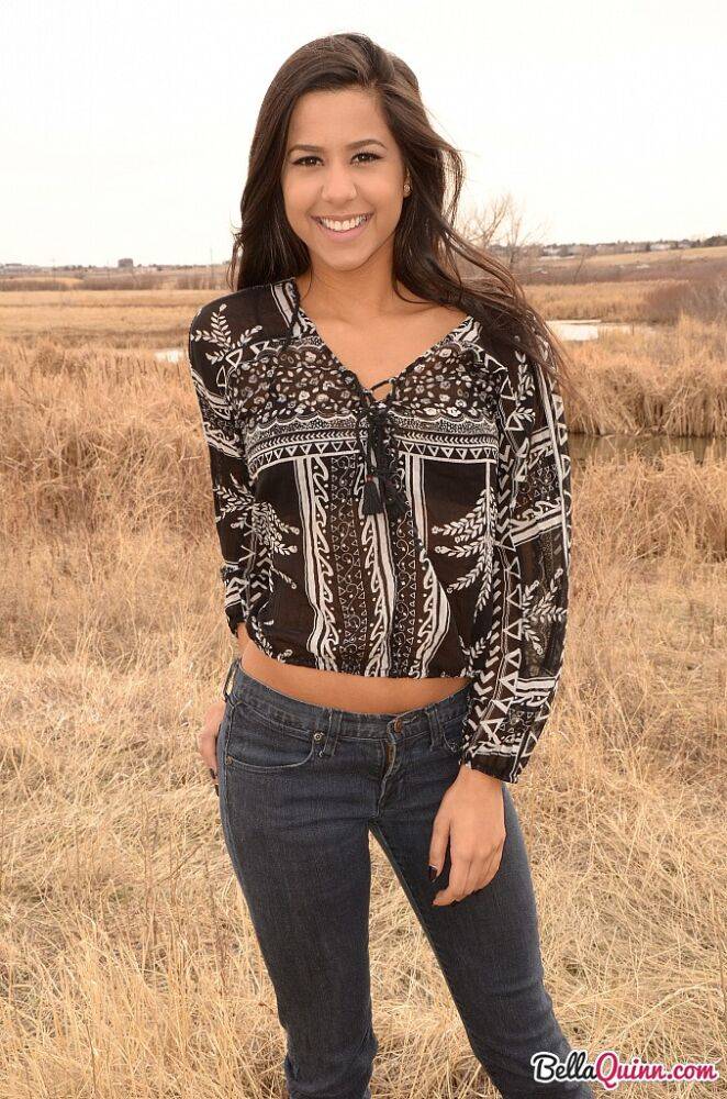 Latina girl Bella Quinn models in a field wearing a bra and jeans - #8
