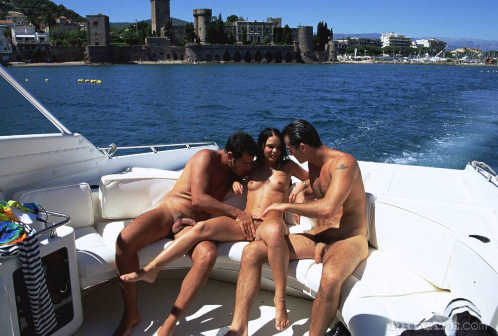 Hot brunette gets fucked by two men at the same time atop a speedboat - #13