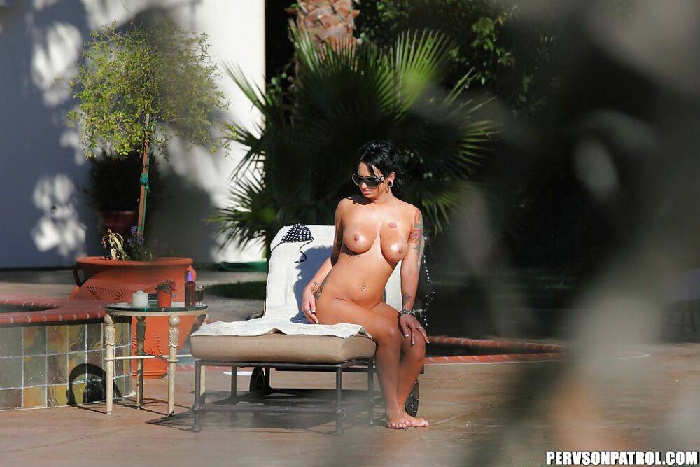 Kitty Bella gets caught on a voyeur photo tanning naked outdoor - #9