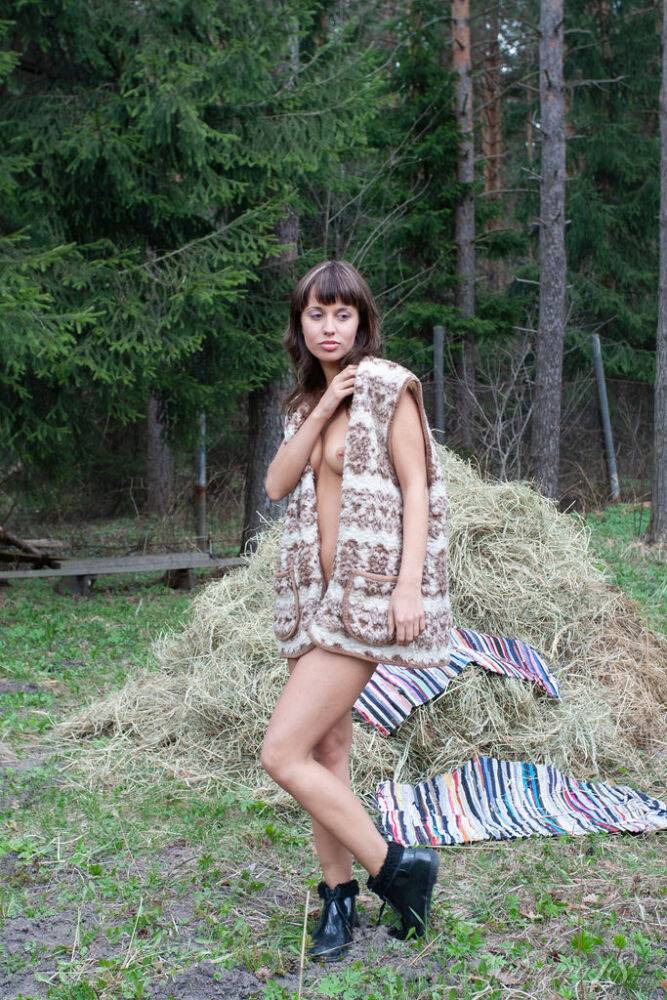 18-year-old girl next door Anna M gets naked in a yard on a mound of hay - #13