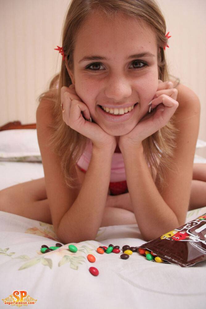 Young looking first timer adorns her totally naked body in M&M'S - #1