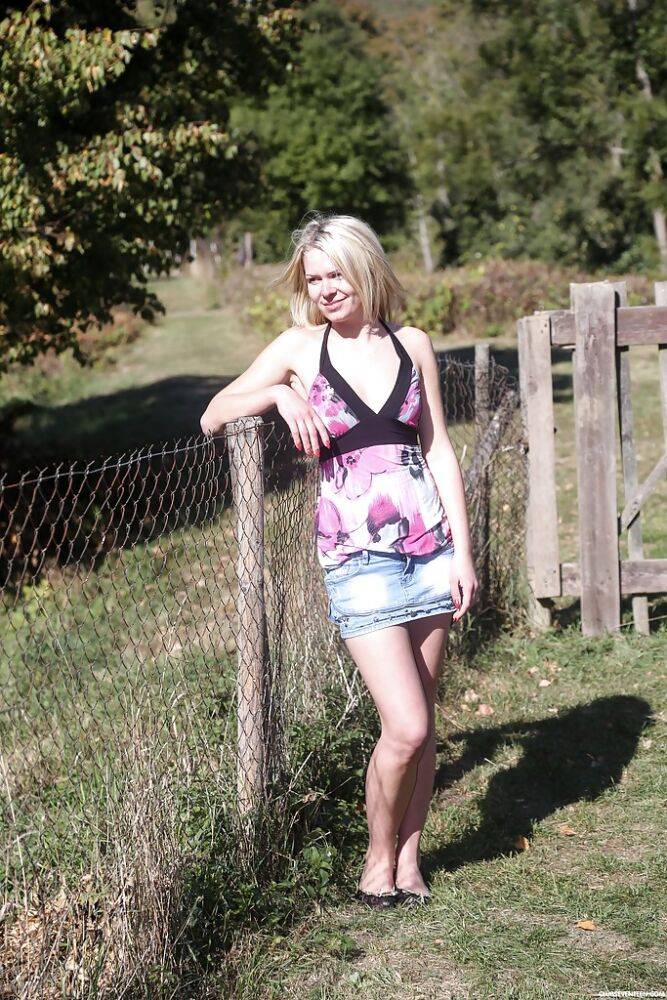 Blonde teen Claudia M disrobing to masturbate outdoors in farmer's field - #8