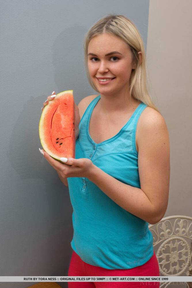 Young blonde Ruth carves up a watermelon before getting totally naked - #11