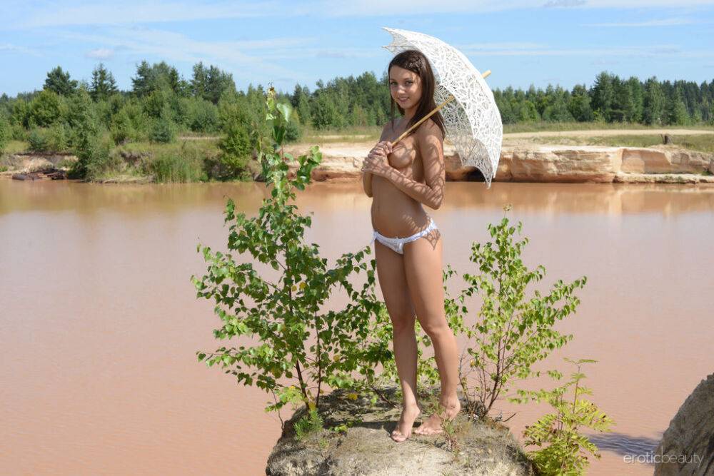 Sweet teen Katoa kicks off her lace panties for nude poses on a rocky outcrop - #13