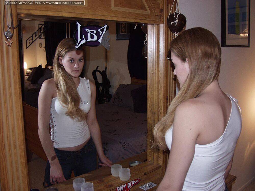 First timer watches herself in a mirror as she takes off her clothes - #3