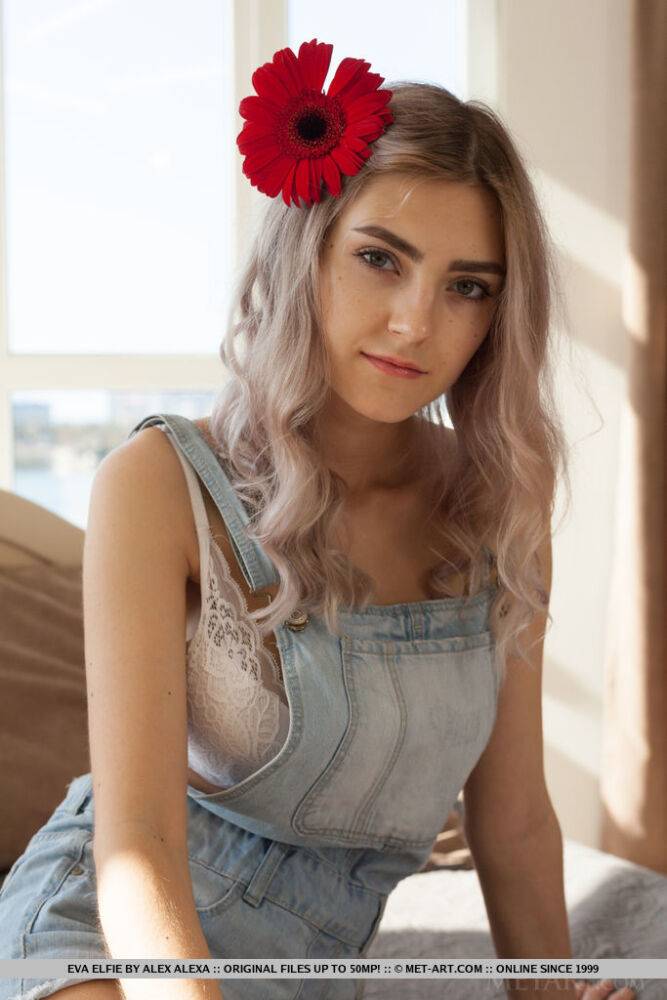 Young blonde Eva Elfie shows off her great body with a flower in her hair - #16