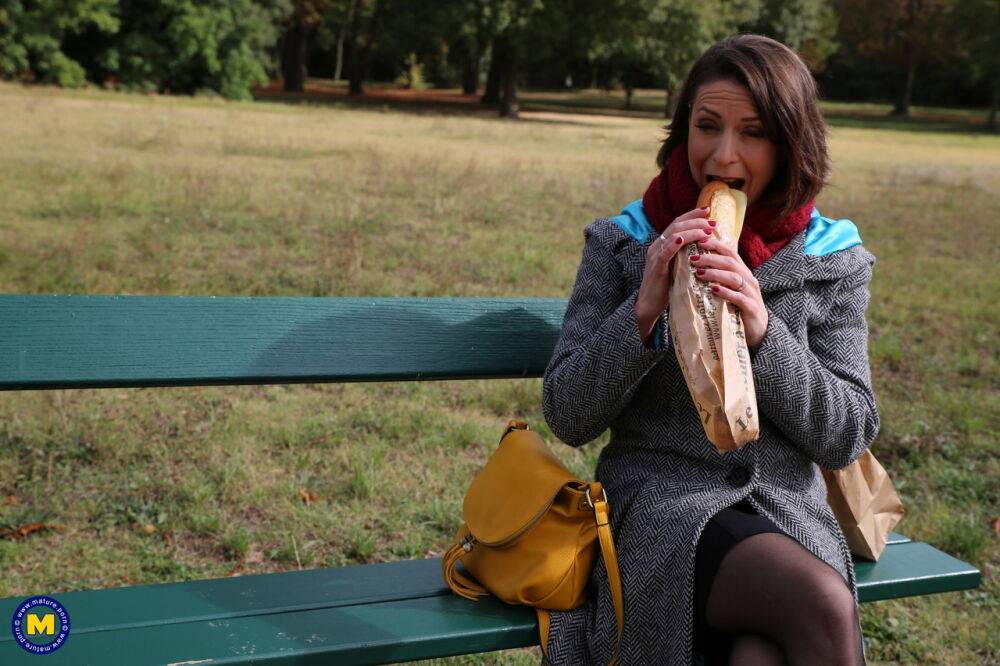 Older woman munches on a loaf on an outdoor bench after getting fucked hard - #13