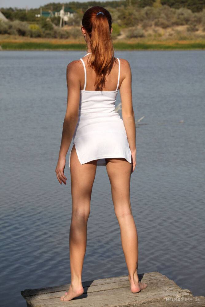 Natural redhead Michelle H sets her young body free of clothes on a dock - #11