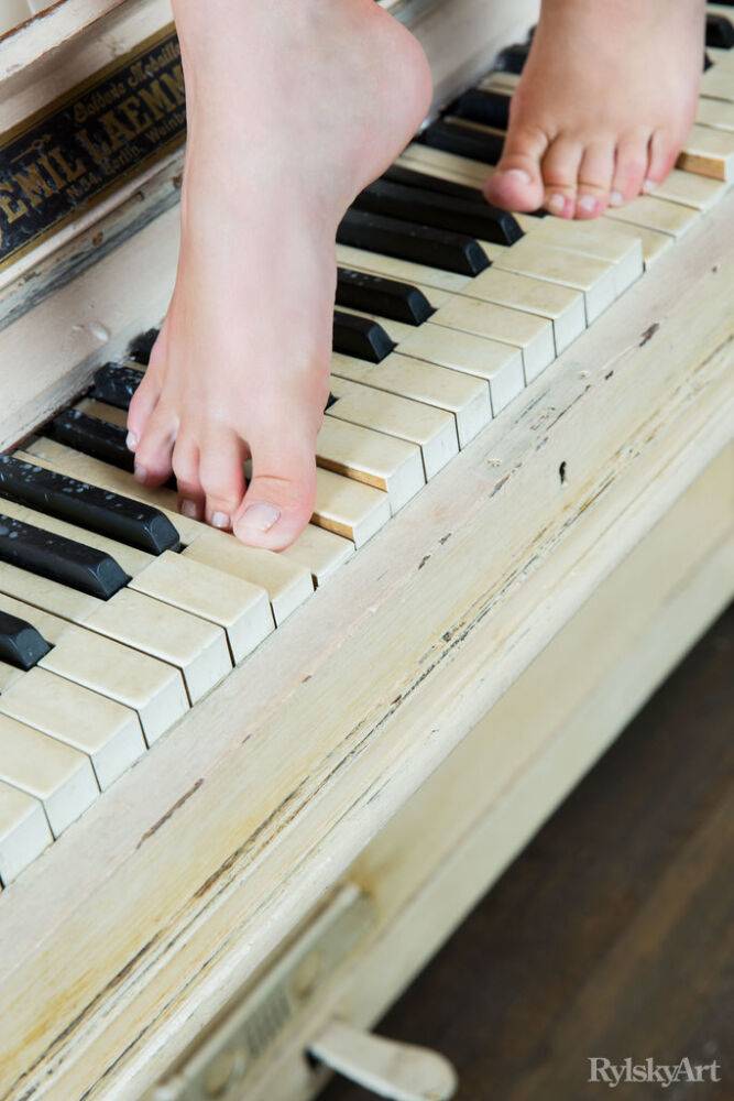 Cute teen girl Jeff Milton models in the nude on top of a piano - #4