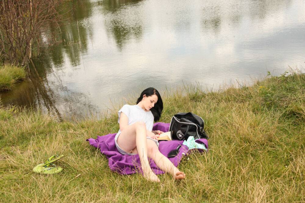 Young girl with dark hair finger fucks her pussy on the bank of a lazy river - #15