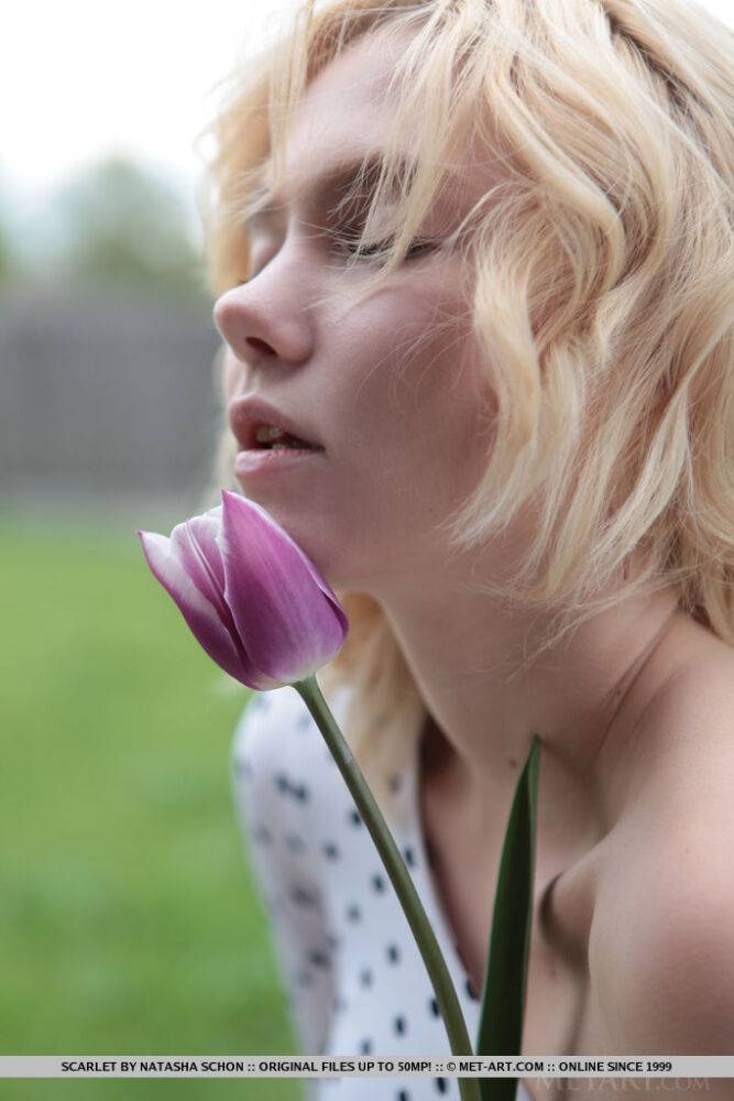 Young blonde Scarlet pauses to sniff a flower before getting naked in the yard - #15