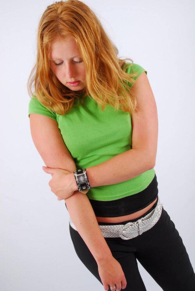 Natural redhead Judy models a double buckle cuff watch during SFW action - #15