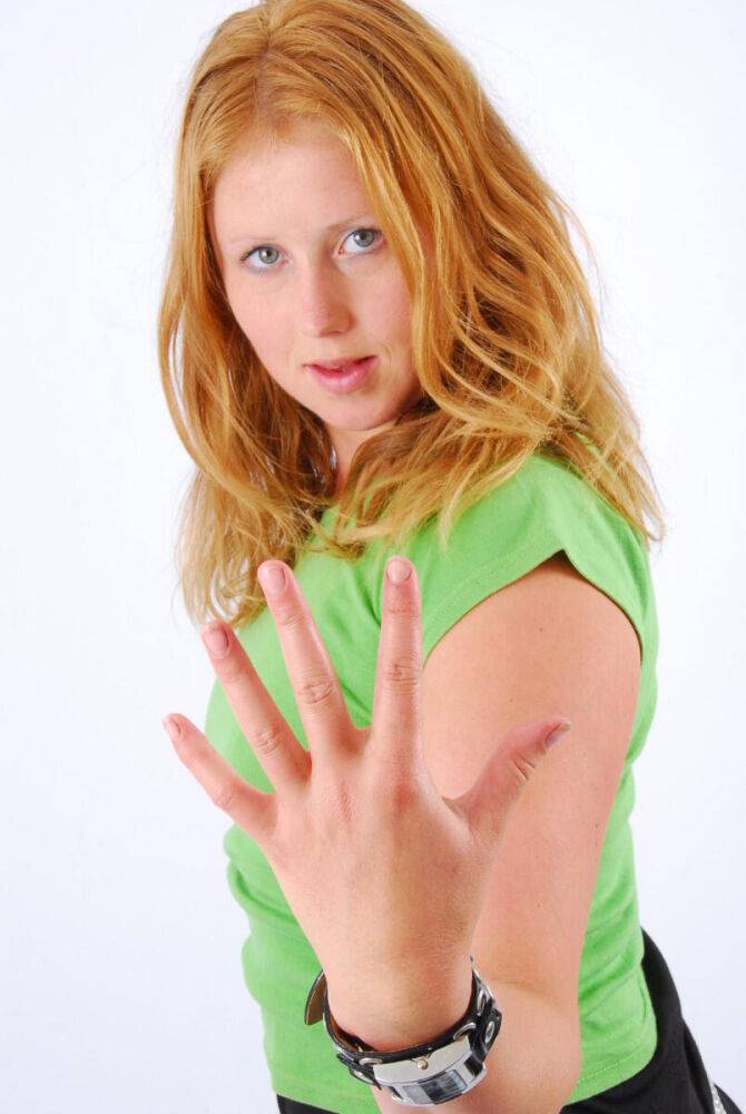 Natural redhead Judy models a double buckle cuff watch during SFW action - #3