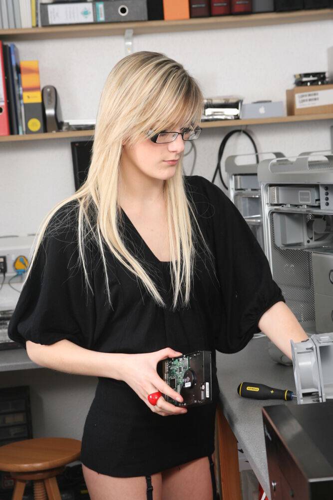 Nerdy blonde teen shows her small tits while repairing a computer - #2