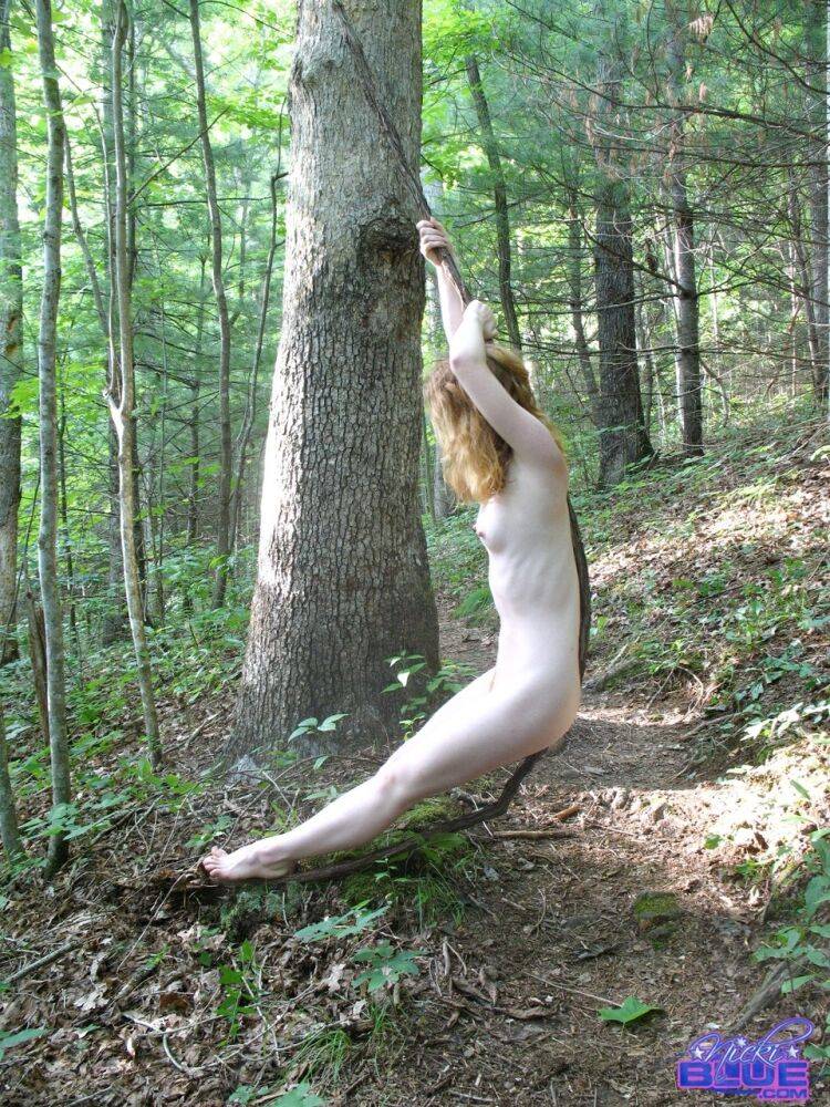 Natural redhead Nicki Blue swings from a tree while totally naked in the woods - #11