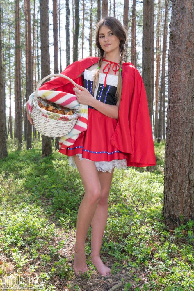 Teen amateur removes a Little Red Riding Hood outfit to get naked in the woods - #15