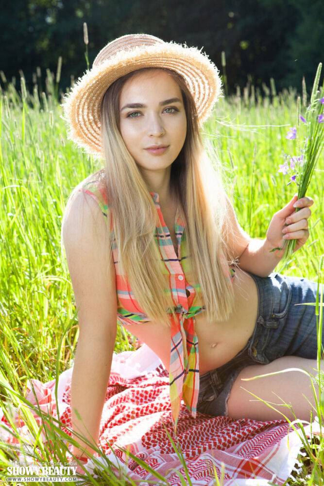 Teen first timer removes straw hat and clothes to model naked in a hay field - #16