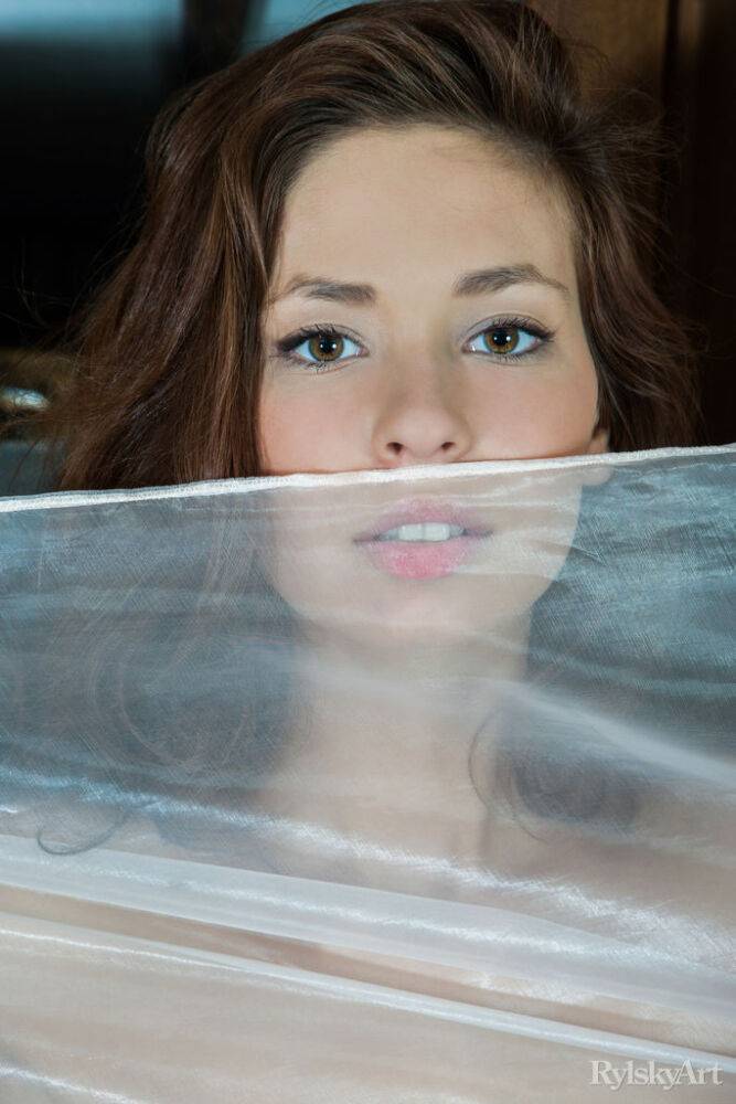 Leggy teen Irina J strikes tempting solo poses inside a log cabin structure - #16