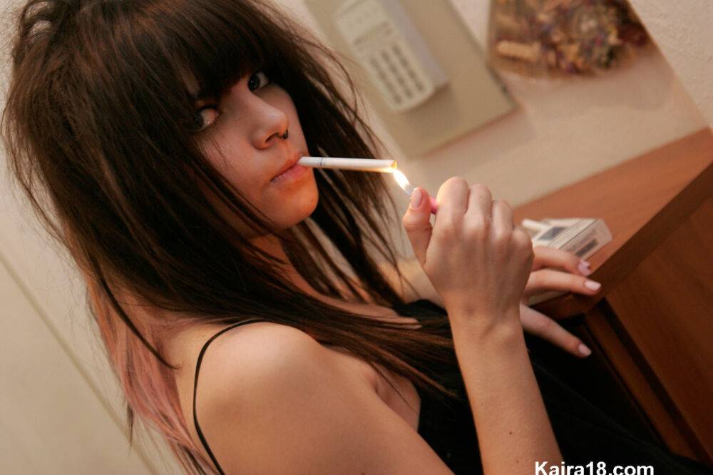 Petite teen Kaira 18 lights up a cigarette before getting totally naked - #1