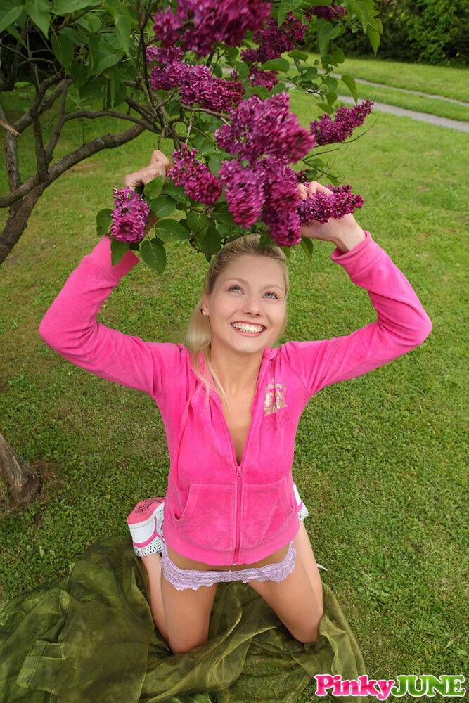 Young blonde Pinky June masturbates on a back lawn in sneakers - #7