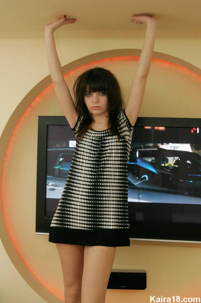 Young solo girl Kaira 18 gets totally naked in front of a television - #6