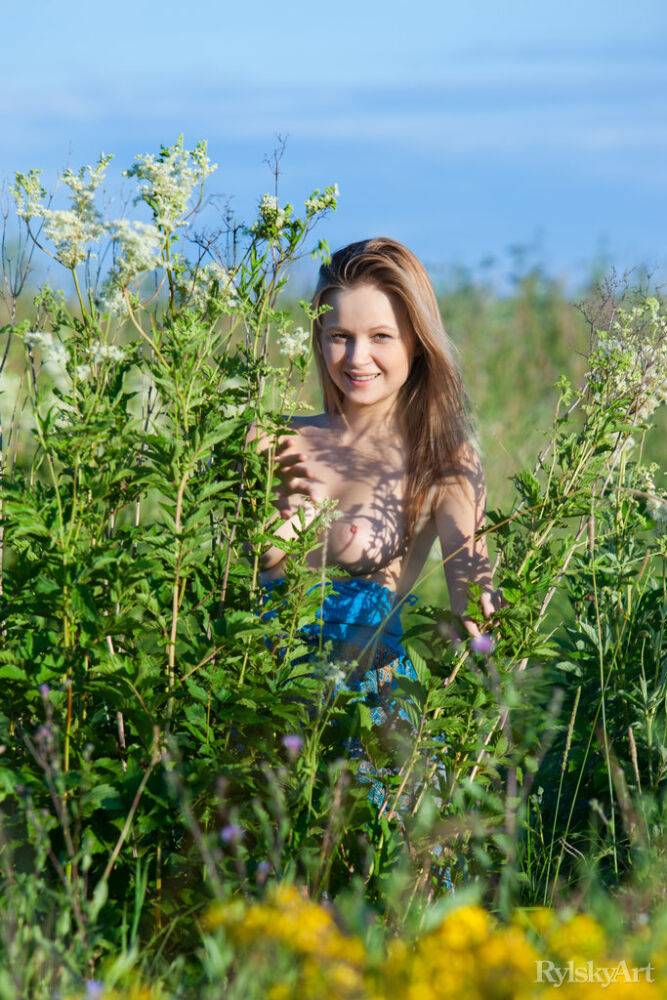 Busty teen Alexandra slips off a dress to go naked amid a patch of wildflowers - #13