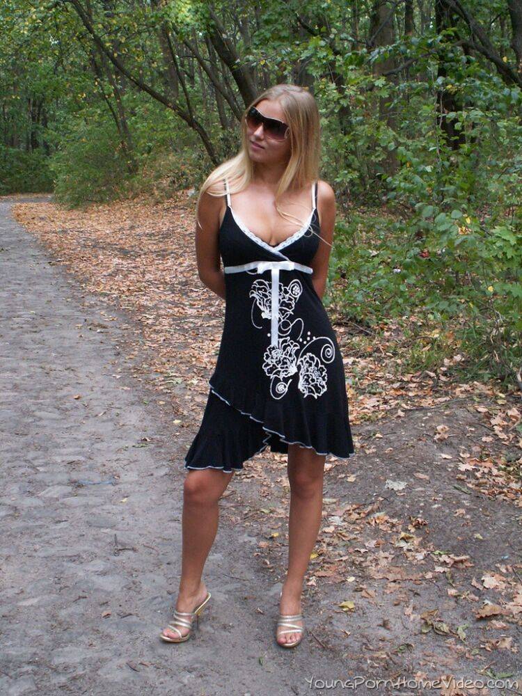 Young blonde with great boobs strips naked on a country road - #10