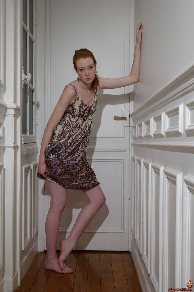 Pale redhead Nathalie Lawson exposes her upskirt underwear in a hallway - #2