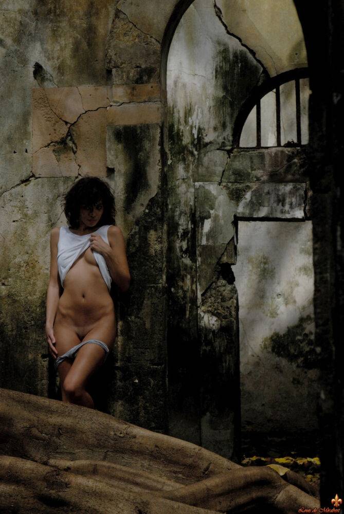 Brunette model Corail hits upon great nude poses in a derelict prison - #10