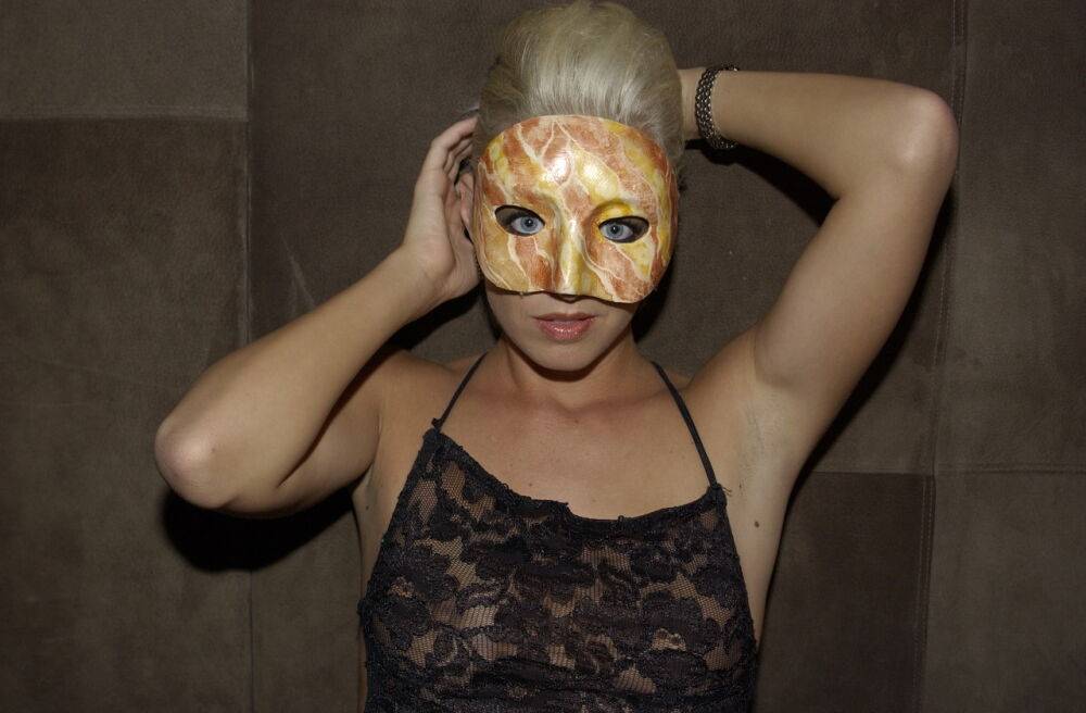 Blonde chick models in the nude in building lobby wearing a mask - #3