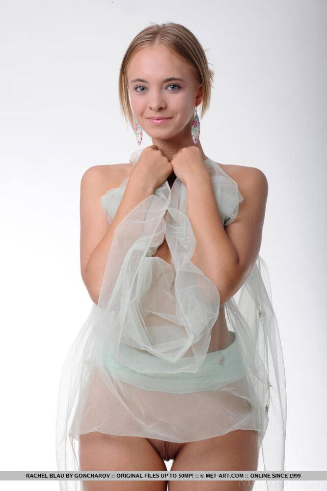 Long-legged teen Rachel Blau holds a fan during a semi-naked glamour shoot - #3