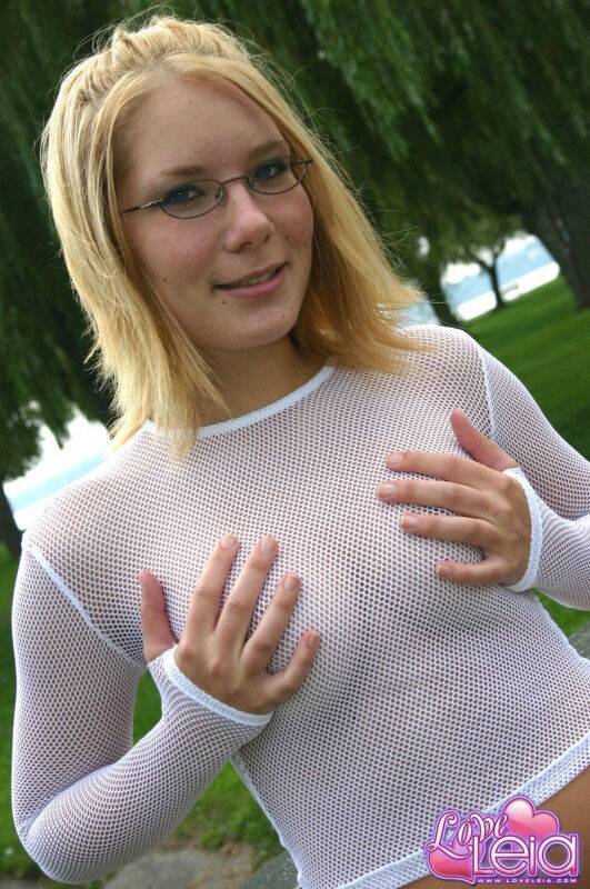 Nerdy blonde girl poses in a see thru top accompanied by her plush toy - #1