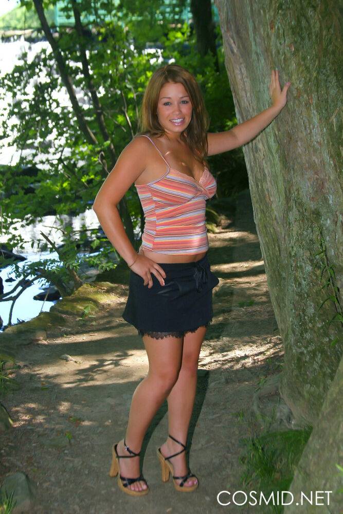 Pretty amateur Dorothy models for a non nude shoot amid trees near the water - #8