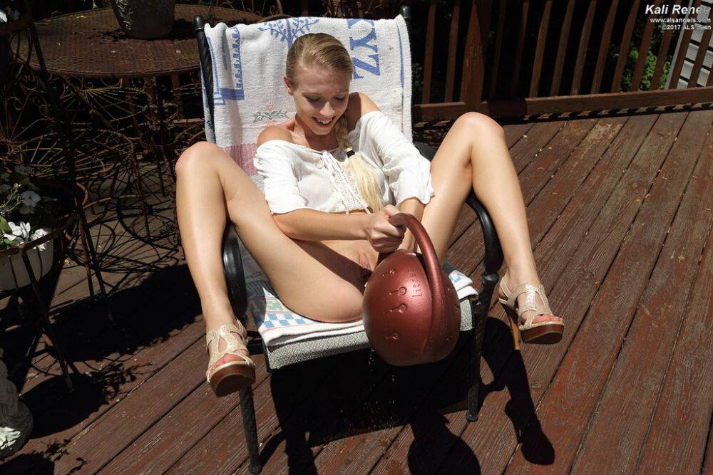 Innocent blonde girl Kali Renee fills her twat with a watering can on the deck - #8