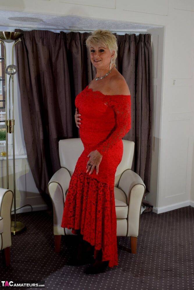 Older lady with short blonde hair Dimonty slips off a long red dress - #10