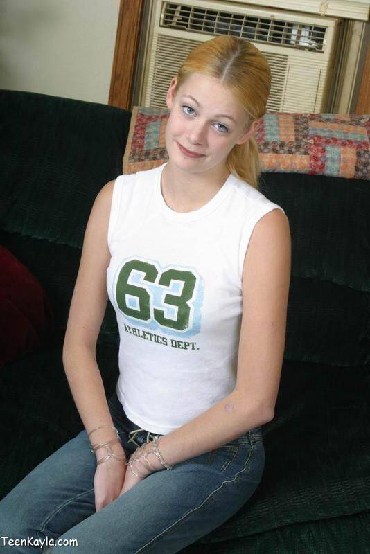 Redheaded teen Kayla doffs a tank top and jeans for her first nudes - #6