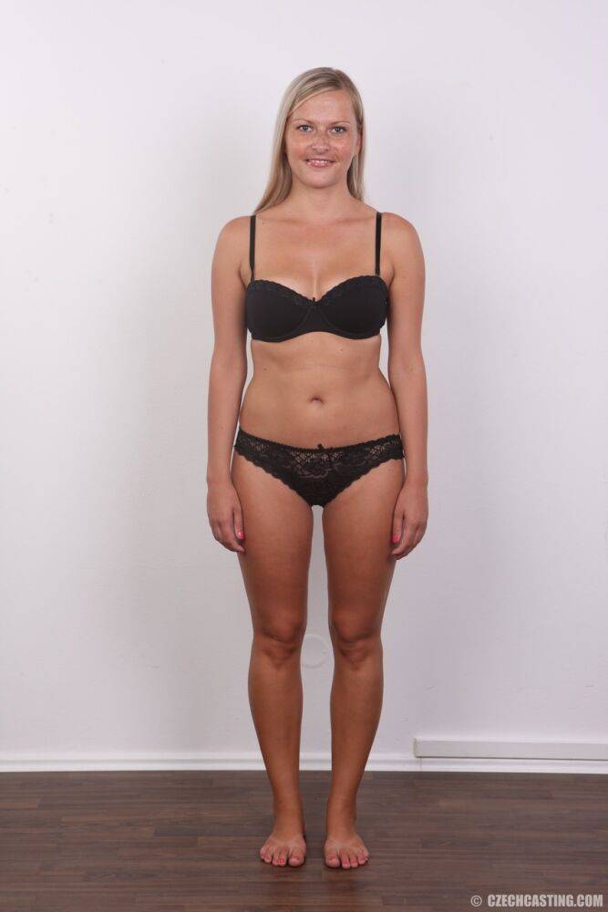 Amateur blonde Petra doffs her black bra and panties for a naked mugshot - #7