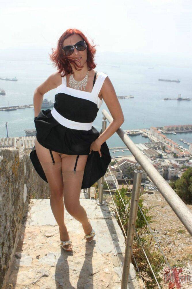 Solo girl flashes a no panty upskirt in nylons while on vacation in Gibraltar - #11