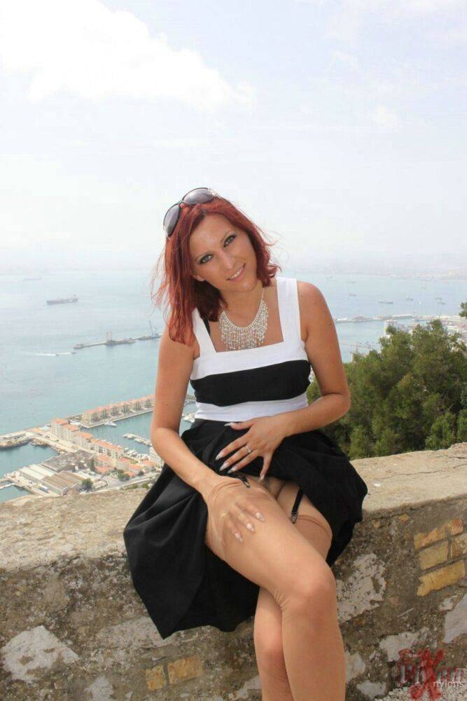 Solo girl flashes a no panty upskirt in nylons while on vacation in Gibraltar - #14